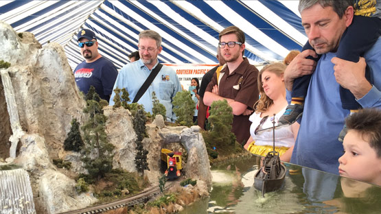 Visitors marvel of one of the many model railroad layouts